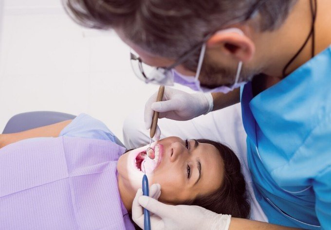 Dentist performing professional cleaning at the Best Teeth Cleaning Center in Shastri Nagar