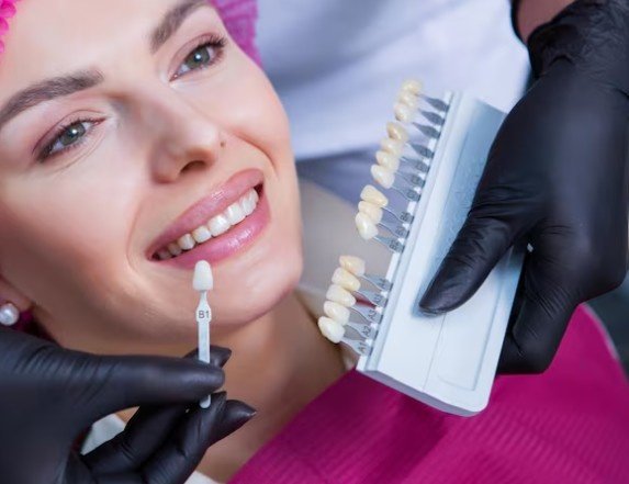 Patient choosing tooth shade for the Best Dental Veneers and Crowns Service in Shastri Nagar.